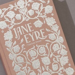 Jane Eyre book cover with floral design by Charlotte Bronte