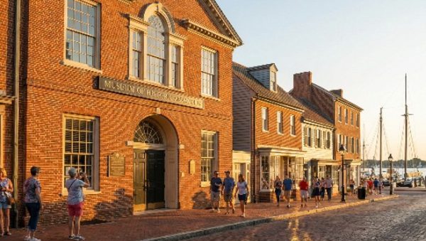 Museum of Historic Alexandria building on a brick street with people walking