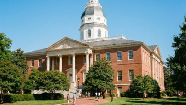 Maryland State House building with dome and trees on a sunny day