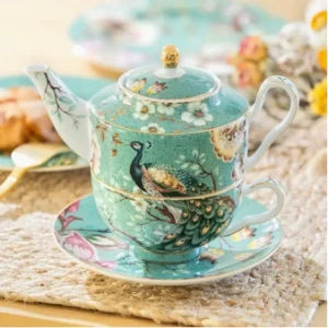 Green peacock fine porcelain tea for one set with teapot, cup, and saucer.