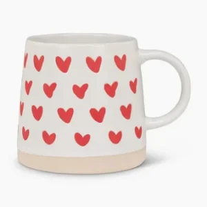 White mug with red heart designs and beige base
