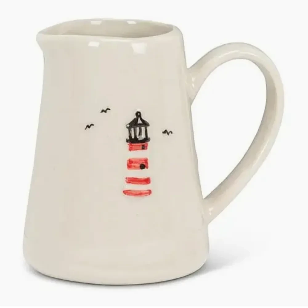 White mini jug with a hand-painted lighthouse and seagulls design