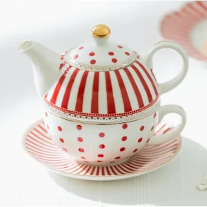 Elegant red and white striped tea set with dots on white saucer